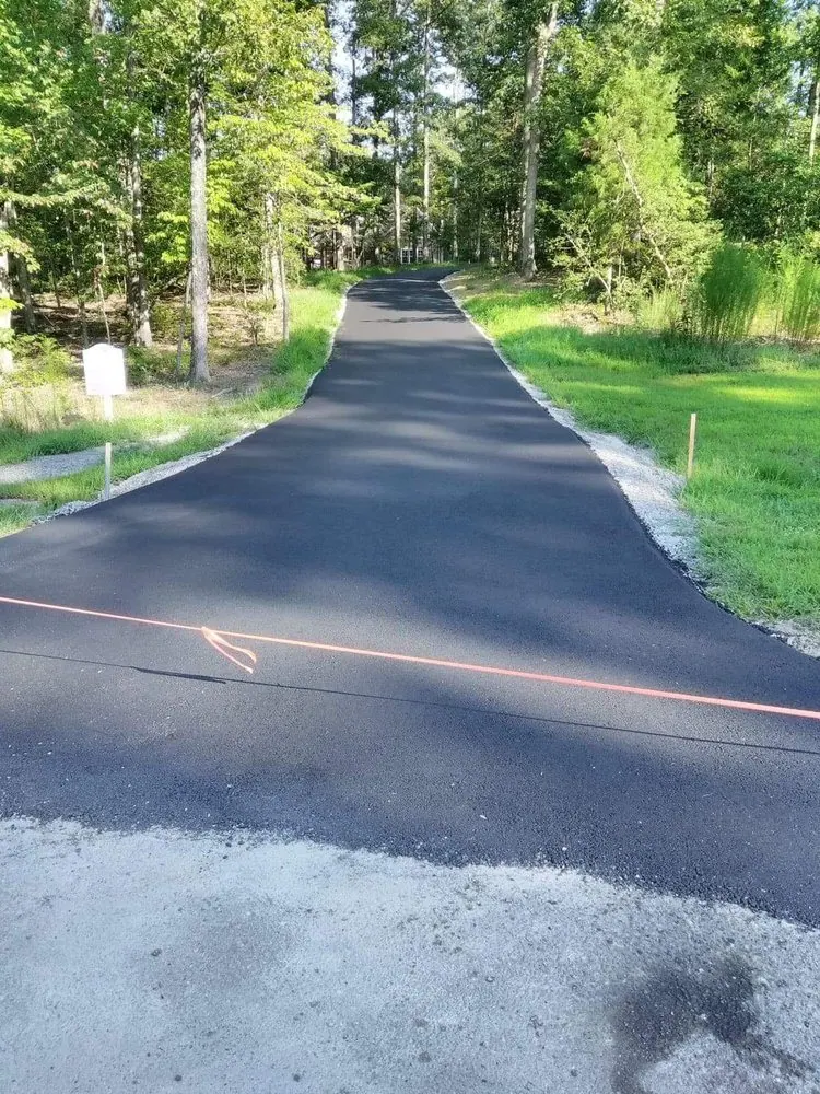 Long ribbon driveway, freshly paved